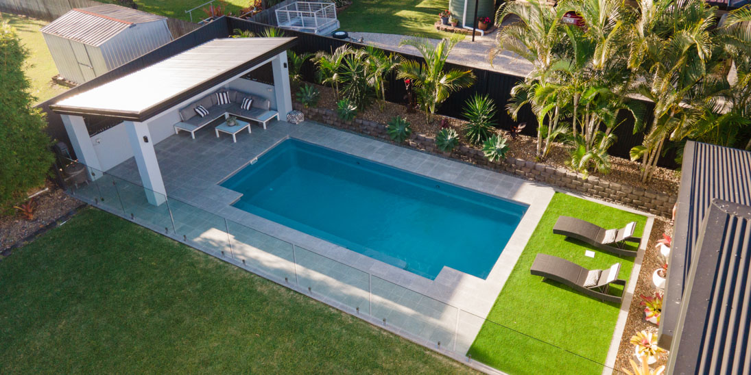 Compact fibreglass pool in a Gold Coast backyard